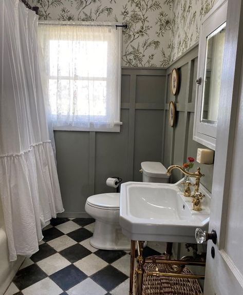 Stacey on Instagram: "I scrubbed a bathroom down on a Monday, and took a picture of it to post on Instagram. This is 48. 😆 Never thought it would be this exciting. Happy Monday everyone! #craftsmanhome #cottagestyle #vintagebathroom #boardandbatten #kingstonbrass #wallpaper #countrysampler #brassfixtures #harlequinfloors #vintagetubandbath #lacecurtains #mythriftedhome #antiquedhome #curatedhome #homemaker #homemaking #cottagecore #cottagecorestyle" French Cottage Bathroom Ideas, Victorian Bathroom Accessories, Black And White Bathroom Floor, French Cottage Bathroom, Black And White Tiles Bathroom, Cottage Bathroom Ideas, White Bathroom Tiles, White Tile Floor, Victorian Bathroom