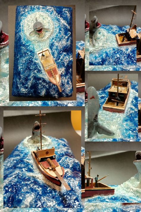 This handmade diorama of a boatman escaping from a shark in the sea is a true work of art. Every detail has been carefully crafted to create a sense of realism, from the waves made by the shark to the expression on the boatman's face. The sea-crafted boat and the man on it have been meticulously crafted to create a lifelike scene that captures the danger and excitement of the moment. #diorama #jaws #orca #homedecor #greatwhite #greatwhiteshark #shark #woodenboat #sharkmovie #resinart Shark Diorama, Sea Diorama, Shark Food, Attack Movie, The Shark, Great White Shark, Great White, Fishing Boat, Wooden Boats