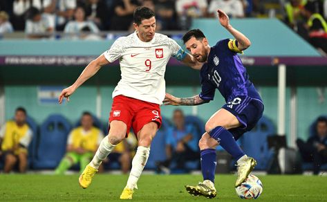 Poland's Robert Lewandowski and Argentina's Lionel Messi battle for the ball during the World Cup group C soccer match between Poland and Argentina at the Stadium 974 in Doha, Qatar, Wednesday, Nov. 30. Argentina beat Poland 2-0. Korea Times photo by Choi Won-suk Argentina Vs Poland, World Cup 2022 Argentina, Argentina Players, World Cup Groups, Argentina Soccer, Soccer Match, Robert Lewandowski, Doha Qatar, World Cup 2022