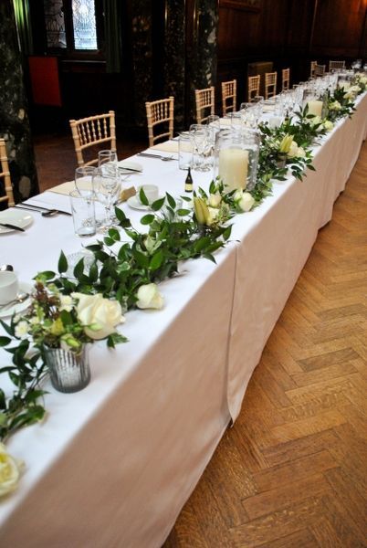 Foliage garland with flowers and candles along the top table. Something along these lines, with softer foliage and some hints of soft pink too. Top Table Flowers, Wedding Table Garland, Wedding Top Table, Head Table Decor, Table Garland, Head Table Wedding, Head Tables, Flowers And Greenery, Elegant Wedding Reception