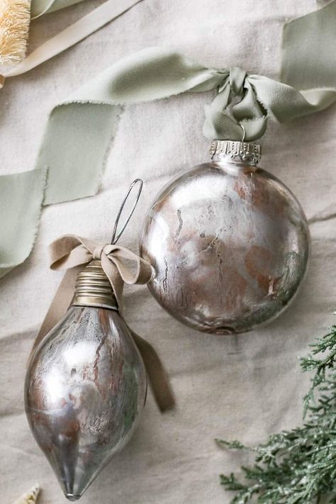 Get ready to impress with these DIY faux mercury glass Christmas ornaments. Your tree will sparkle like never before! Faux Mercury Glass Ornaments Diy, Diy Clear Ornament Ideas, Diy Mercury Glass Ornaments, Glass Ornaments Diy, Looking Glass Paint, Krylon Looking Glass, Dollar Tree Mirrors, Clear Plastic Ornaments, Mercury Glass Diy