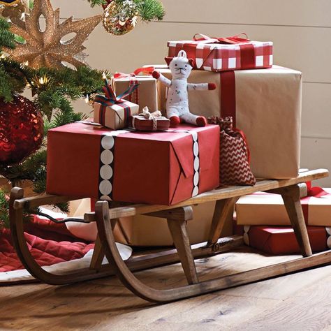 Wooden sleigh to hold Christmas presents Outdoor Christmas Presents, Christmas Sled Decoration, Christmas Sleigh Decorations, Sled Decor, Christmas Coffee Table Decor, Christmas Booth, Wooden Sleigh, Lights For Christmas, Whoville Christmas