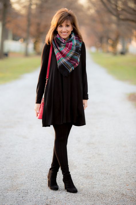 It's the Christmas season and today I'm showing how to style a swing dress with a plaid scarf and a red crossbody bag. This is a festive look! Black Dress And Leggings Outfit, Winter Dress With Leggings, Long Dress With Leggings, Black Dress With Leggings Outfit, Dresses And Boots Winter, Black Dress With Boots Winter, Long Sleeve Black Dress Outfit Casual, Short Dress In Winter, Dresses With Leggings Winter