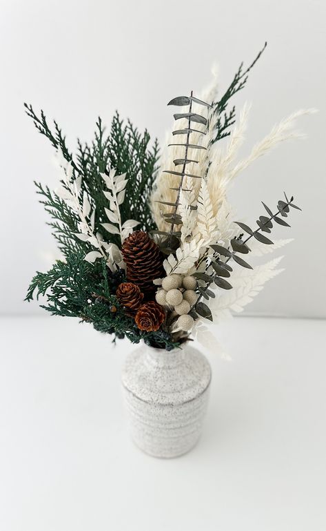 Pine Cone Vase Christmas, Christmas Dried Floral Arrangements, Winter Dried Flower Arrangements, Small Winter Floral Arrangements, Winter Bud Vases, Winter Dried Flowers, Holiday Floral Centerpieces, January Table Centerpieces, Pampas Christmas Decor