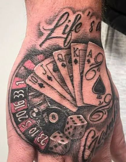 Living is a gamble; risk-taking, stakes, and unpredictability in life are all represented by tattoos. Do you think that living life is similar to playing poker? Nothing is certain. Everything is determined by fate and calculated actions. You may achieve several victories in this game if you play your cards well. Your choice of tattoo … 15 Lifes a Gamble Tattoo- Finding Strength in the Game of Life Read More » The post 15 Lifes a Gamble Tattoo- Finding Strength in the Game of Life... Life Is A Game Tattoo, Gambling Hand Tattoo, Life's A Gamble Tattoos, Lifes A Gamble Tattoos, Life Is A Gamble Tattoo Design, Play For Keeps Tattoo, Life Is A Gamble Tattoo, Gambling Tattoo Design, Life’s A Gamble Tattoo Design