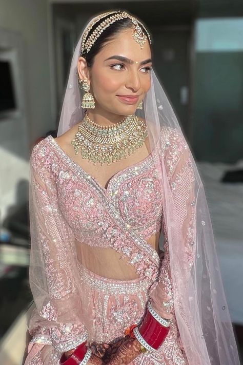 The minimal makeup, pastel pink lehenga & a hint of red bridal chooda to make it pop
- we are pinning this bridal inspiration right away! When it comes to wedding lehengas, red has always been a favourite with brides. But off late, brides are giving the traditional red lehenga a miss and opting for a different and unique hue when it comes to picking up their bridal lehenga – powder pink! A pale shade of pink that is in the pastel family has been a bridal favourite off late for your wedding day. Manushi Chiller In Prithviraj, Pale Pink Lehenga, Pastel Bridal Jewellery, Light Pink Wedding Lengha, Light Pink Wedding Lehenga, Minimal Chooda, Light Pink Lehenga Jewellery Ideas, Baby Pink Lehenga Bridal, Jewellery With Pink Lehenga