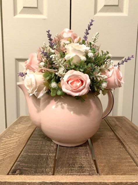 Pretty in Pink! This artificial arrangement features pink and cream roses. It is so pretty....display it all year. Rose Flower Arrangements Vases, Tea Pot Flower Arrangements, Tea Time Flower Arrangements, Tea Party Flower Arrangements, Teapot Vase Flower Arrangements, Teapot Floral Arrangements, Teapot Flower Arrangements, Teapot Arrangements, Flower Arrangement In Tea Pot