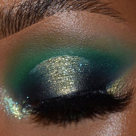 Halo eyeshadow in dark forest and lime green with full lashes.