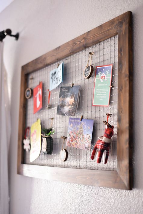 DIY Wood and Chicken Wire Christmas Card Holder | Our Handcrafted Life    This super versatile DIY project that could be really used throughout the year, but around the holidays I love to use it as a DIY Chicken Wire Christmas Card Holder. This Christmas card display allows all those Holiday cards to be wall decor instead of sitting in a pile. Hand ornaments, pictures, kid's art, and cards on this framed chicken wire piece that's part wall art and part organization. Chicken Wire Picture Display, Diy Photo Holder Wire, Chicken Wire Photo Display, Farmhouse Christmas Decor Diy, Picture Holder Diy, Diy Chicken Wire Frame, Diy Wood Picture, Chicken Wire Display, Wood Picture Holder