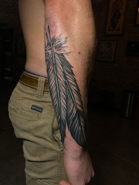 Mens Feather Tattoo Forearm, Men Feather Tattoo Ideas, Western Feather Tattoo Men, Country Neck Tattoo, Warrior Feather Tattoo, Mens Native Tattoos, Indian Arm Tattoo, Western Tattoos For Men Country, Cowboy Tattoos For Men Forearm