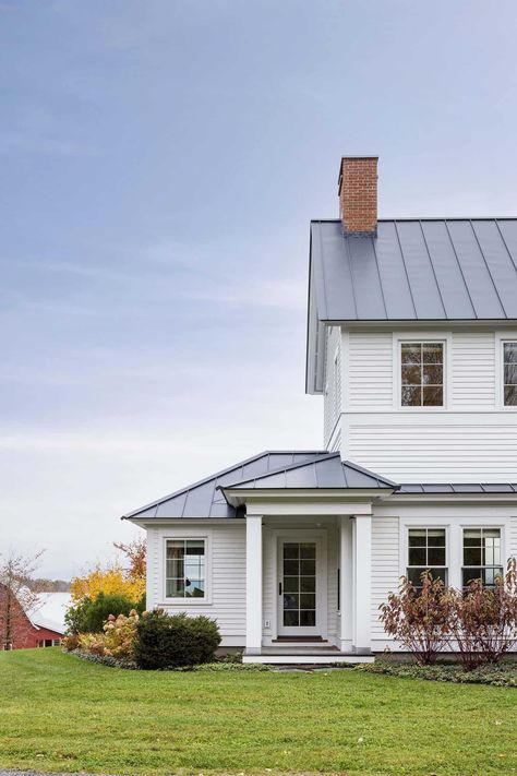 A peek into this timeless Vermont farmhouse with beautiful living spaces Colonial Country House, Vermont Country House, Vintage White Farmhouse Exterior, White Farmhouse With White Windows, Dutch Farmhouse Exterior, White Farmhouse Metal Roof, Timeless Farmhouse Exterior, White House With Metal Roof, 1800s Farmhouse Exterior