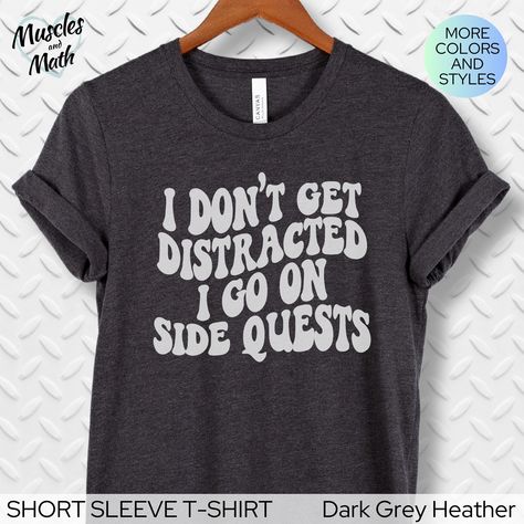 💖  Let your body speak your mind - I don't get distracted, I go on side quests.  This funny ADHD shirt is soft and comfortable to wear.  The retro wavy design is high quality that will last, making it the perfect gift for friends, family, coworkers, or YOU! SHORT AND LONG SLEEVE T-SHIRT PRODUCT SPECIFICATIONS .: 4.2 oz., Heather and Solid Blend colors - 52% airlume combed and ringspun cotton, 48% polyester, 32 singles .: Athletic Heather, Black Heather: 90% Airlume combed ringspun cotton, 10% p Cricut Funny Shirt Ideas, Funny Tshirt Ideas For Women, Tshirt Design Funny Shirt Ideas, Fun Tshirts Sayings For Women, Funny T Shirts For Women, Funny Work Shirts, Funny Graphic Crew Neck T-shirt, Fun Tshirt Designs, Vinyl Designs For Shirts