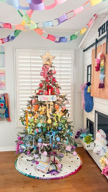 Tina Green | TheBearAndTheFawn on Instagram: "Theo’s bedroom reveal!! 🎄🌈 A rainbow holiday room for my rainbow loving boy! I’ll share a closer look at details soon, but hope you love this as much as we do! I can’t think of a happier space for the holidays💖 Tree: @kingofchristmas Candy cane wreath: @dollartree diy inspired by @ambusheedwithboys & @opal_auktober Magical sign: @chalkdesignsbyme Rainbow garland: @pearlandjane x @kelseyklos collab Tree topper: @michaelsstores Guitar: @loogguitars Flowers: @dollartree Rainbow fabric blanket : @joann_stores Velvet ribbon: @etsy and @anthropologie Stockings: @target last year #rainbowchristmas #colorfulchristmas #christmasinspiration #holidaydecor #kidsholiday #rainbow #colorfuldecor" Rainbow Baby Christmas Tree, Rainbow Christmas Tree Ornaments, Rainbow Tree Decorations, Pastel Rainbow Christmas, Kids Christmas Tree In Room, Anthropologie Stockings, Rainbow Christmas Tree Ideas, Rainbow Christmas Tree Decorations, Rainbow Christmas Decor