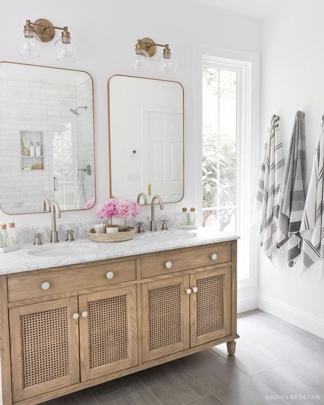 Mixing Metals in Your Bathroom: Tips for Pulling it Off! - Driven by Decor Bathroom Vanity Gold Hardware, Aged Brass Light Fixtures, Gold Hardware Bathroom, Mixed Metals Bathroom, Mirrors And Lights, Mirrors With Leather Straps, Bathroom Mirror Ideas, Chrome Towel Bar, Wood Medicine Cabinets