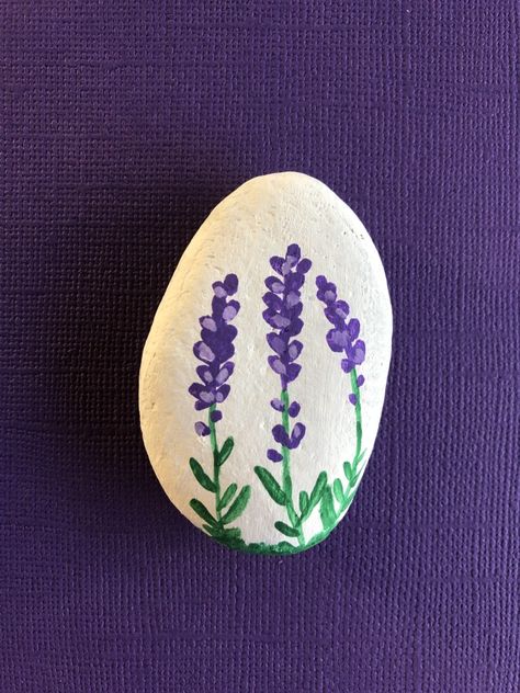 @rockin.andrvin Rose Rock Painting, Purple Rock Painting Ideas, Rock Painting Ideas Purple, Painted Stones Ideas, Roses Painted On Rocks, Rocks For Garden, Purple Lupine, Lilac Rock Painting, Rock Animals