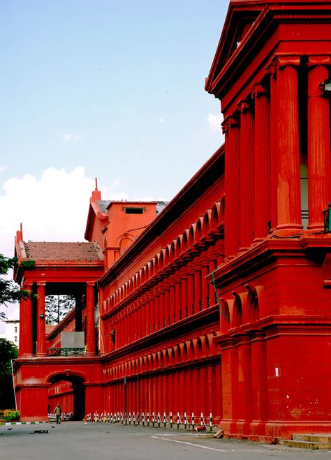 This two-storied building, built in 1867 under the reign of Tipu Sultan, is painted in red with Corinthian columns in Gothic style architecture. It's located at the entrance to Cubbon Park, and houses the High Court and many lower courts. Namma Bengaluru, Bangalore City, Amazing India, India Trip, Central Library, Travel India, Bangalore India, India India, High Court