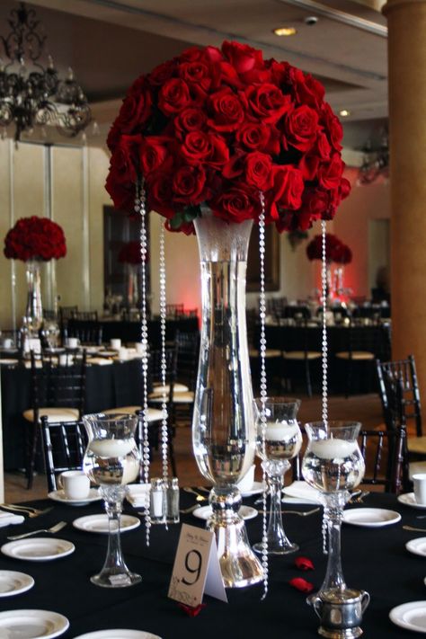 tall red rose wedding centerpieces | Beautiful red rose centerpieces dripping in bling adorned each table. Red Roses Centerpieces Birthday, Red Rose Centerpiece Wedding, Red Roses Centerpieces, Rose Centerpieces Wedding, Red Rose Wedding, Rose Centerpieces, Beautiful Red Roses, Tall Vase, Diy Centerpieces