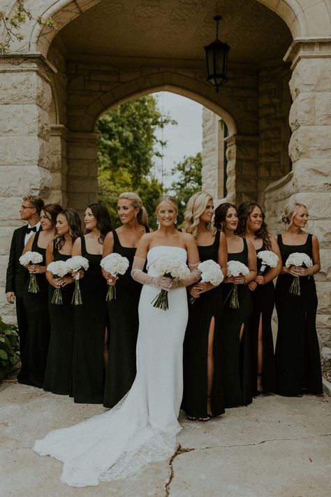 Bride-smiles-as-she-poses-with-her-bridesmaids,-captured-by-McKenna-Christine-Photography Wedding Venues Black Themed, Classy Vintage Wedding Decorations, Wedding Color Themes With Black, Groomsmen Black And White Attire, Creme And Black Wedding, Luxury Black Tie Wedding, Wedding Ideas White And Black, Weddings With Black Color Palettes, Modern Wedding Bridal Party