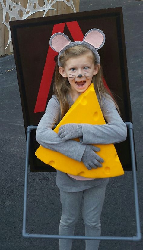 Mousetrap costume. made it with foam board with brown spray paint and red tape, pvc piping with gray spray paint for the trap bar, I bent 2 metal hangers for the strap to hold it on her back, cheese hat and grey clothes and ears. Easy costume to make and Emily won 1st place in 3 different contest. Diy Mouse Costume, Kids Mouse Costume, Mouse Costume Diy, Brown Spray Paint, Easy Costumes To Make, World Book Day Outfits, Cheese Costume, Kids Dress Up Costumes, Last Minute Kostüm