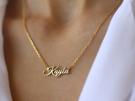 Solid Gold Personalized Name Necklace, Customized Your Name Jewelry, Dainty 14K Name Necklace, 14K Tiny Name Necklace, Bridesmaid Gift14K Solid Gold Dainty Name Necklace The most unique jewelry you can find, perfect gift for you and your loved one Names are important to new relationships, as a person’s name connects to their identity and their individuality. This exclusive stunning statement piece can be worn everyday or for a special occasions.Material: High Quality 14K Solid Gold (Not gold fil Customized Necklace Names, Name Jewelry Necklace, Custom Name Necklace Gold, Name Jewelry Personalized, Custom Necklace Names, Name Chains Necklace Gold, Gold Name Necklace Unique, Name Chain Gold, Gold Necklace With Name