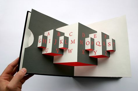 I’ve always wondered why books with paper gimmicks were mostly designed for children books, but now there is a great example that targets type lovers and graphic designers. This Movable book … Movable Book, 3d Book, Buch Design, Paper Engineering, Pop Up Art, Paper Pop, Creative Books, Interactive Book, Up Book