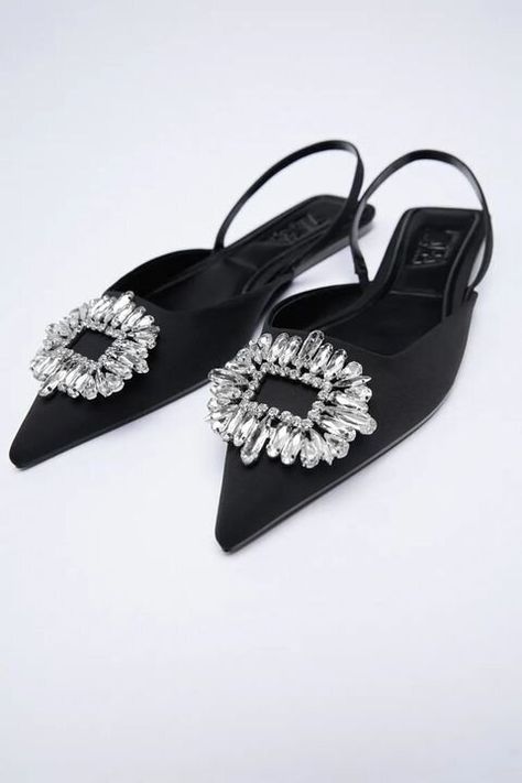 Zara Flat Mules with Rhinestone DetailFlat mules available in different colors. Squared vamp. Rhinestone detail at front. Pointed Toe. Square Shaped back Purchase Worn by Princess Beatrice on:30 June 2021 Zara Mules, Zara Flats, Insole Design, Zara Heels, Affordable Shoes, Rhinestone Flats, Classy Shoes, Sparkly Heels, Stunning Shoes