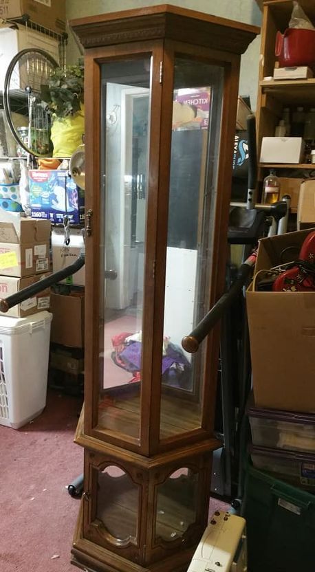 I picked up this cabinet at a yard sale. I didn't realize that it wasn't real wood. It looks like wood but it's some plastic type stuff the base is particle board. This cabinet is going to hold my salt and pepper shakers. I needed more shelves. The shape of the cabinet didn't allow room for a drill to make holes for shelf supports so I took it apart. Here it is stripped of all hardware, hinges, knobs, glass, shelf supports and lights. I used acetone and a rag to strip off most of the f… Antique Corner Curio Cabinet, How To Redo Curio Cabinets, Update A Curio Cabinet, Display Cabinet Decor Living Rooms, Refurbish Curio Cabinet Ideas, Curio Cabinets Makeover, How To Paint A Curio Cabinet, Update Curio Cabinet Ideas, Refinishing Curio Cabinet Ideas