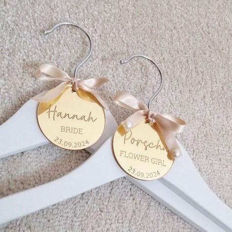 Name hangers are not only perfect for your wedding party attire but as a keepsake for after your wedding day for every special human involved. Description Personalised mirror tags place name etched in mirror acrylic. Choose your favourite colour and let us know the text. Each will have a hole to tie ribbon or twine. The diameter is 6cm. Styling and text may vary to keep up with current trends. Processing time Order processing time is currently 5-15 working days however there is an option for urg Wedding Coat Hangers, Affordable Wedding Centerpieces, Wedding Party Attire, Bridal Party Hangers, Resin Necklaces, Name Hangers, First Communion Decorations, Wedding Acrylic, Acrylic Keepsakes