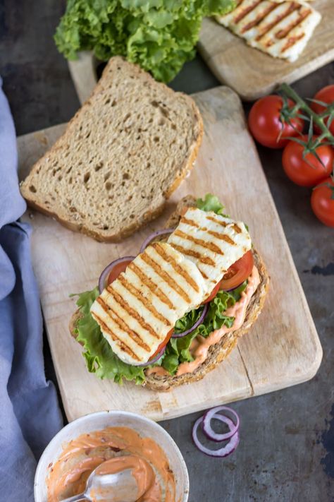 This easy Halloumi Sandwich recipe is a hit for lunch or dinner and comes together in only 15 minutes! Enjoy grilled halloumi cheese in a delicious classic sandwich spread with a homemade Sriracha mayo for a spicy kick. Halumi Cheese Grilled Sandwich, Grilled Halloumi Sandwich, Halumi Cheese Breakfast, Halloumi Sandwich, Mediterranean Platter, Halloumi Cheese Recipes, Sandwich Cafe, Sandwich Spread Recipes, Homemade Sriracha