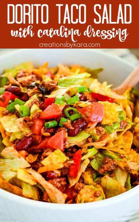 Looking for a simple and satisfying meal for Taco Tuesday? Whip up this Doritos taco salad that's packed with flavor and crunch. Get the recipe now! #tacosalad #doritotacosalad #tacotuesday -from Creations by Kara Mexican Food Recipes Salad, Thousand Island Taco Salad, Dorito Taco Salad With Catalina Dressing, 7 Layer Taco Salad Recipe, Doritos Taco Salad Recipe, Dorito Salad, Crowd Meals, Doritos Taco Salad, Dorito Taco Salad