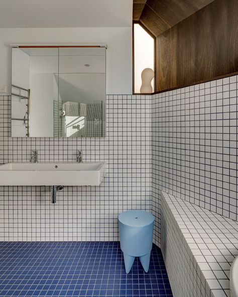 Blue and white tiles – with inverted grouting – accentuate the unusual lines of the bathroom. Blue Grout, Blue And White Tiles, Full Bathroom Remodel, Attic Conversion, Garden Suite, Marble Statues, White Tiles, Grout, House 2