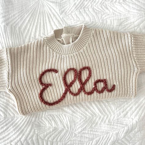 Adorned with delicate hand embroidery, this cozy beige sweater is personalized with the sweet name Ella. 🤍 DETAILS Size 12-18mths Sweater - cream Thick yarn - pastel red #handembroidery#handmade #babysweater#babyfashion#etsyshop#smallbuisness#stitched#babygift#newborngift Pastel Red, Sweater Cream, Thick Yarn, Beige Sweater, Baby Sweaters, Future Baby, The Sweet, Baby Fashion, Hand Embroidery