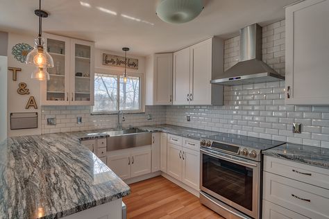 White Cabinets with Silver Cloud Granite Countertops Installed by Titan Granite in St. Louis, MO White Cabinets Grey Granite Countertops, Silver Gray Granite Countertops, Granite Countertops With Grey Cabinets, Granite Countertops With White Cabinets, Silver Cloud Granite, Gray Granite Countertops, Silver Cloud Granite Countertops, Temporary Kitchen, Grey Granite Countertops