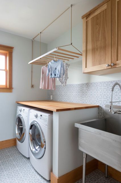 Pros Share 8 Laundry Room Must-Haves Ceiling Drying Rack, Laundry Inspiration, Utility Room Organization, Laundry Room Decor Ideas, Transitional Laundry Room, Small Utility Room, Second Story Addition, Custom Laundry Room, Pantry Laundry Room