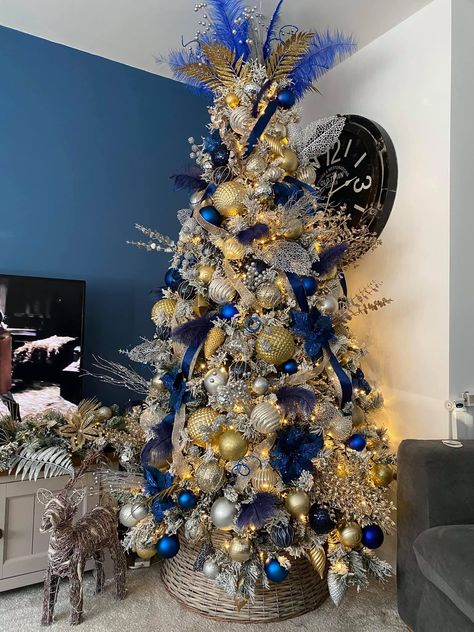 Blue silver and gold Flocked Christmas Trees Decorated Blue And Gold, White Blue And Gold Christmas Tree, Christmas Tree Royal Blue, Blue Gold And White Christmas Decor, Christmas Tree Blue Silver And Gold, Christmas Tree With Blue And Gold, Blue Decoration Christmas Tree, Royal Blue Gold Christmas Tree, Navy Gold Silver Christmas Tree