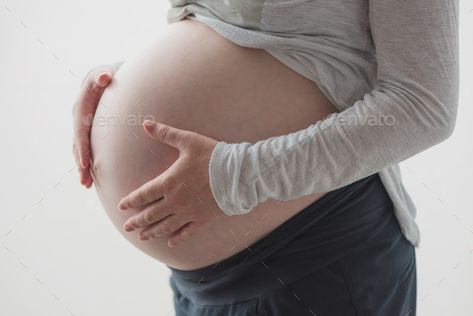 Pregnant woman tummy by stevanovicigor. Pregnant woman tummy, female person in ninth month of pregnancy posing #Sponsored #stevanovicigor, #female, #tummy, #Pregnant Pregnant Tummy, Photo Window, Pregnancy Months, Maternity Poses, Nine Months, Pregnant Woman, Pregnant Women