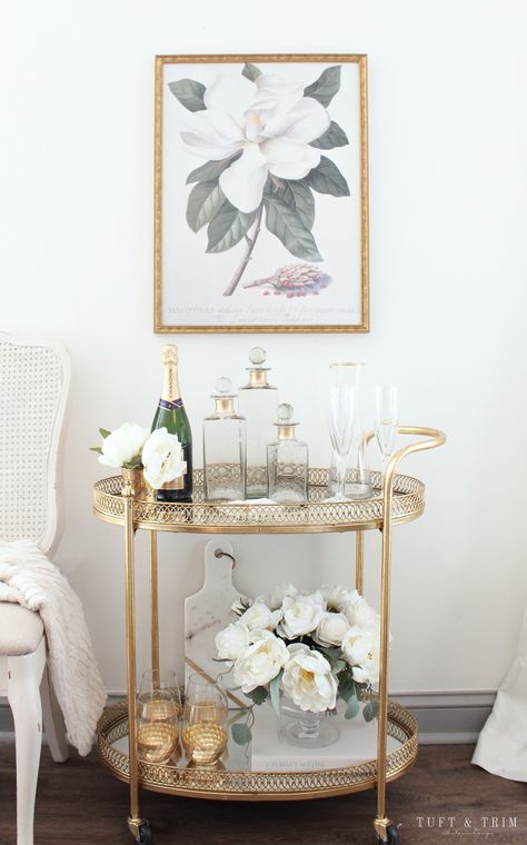 Bar Cart Styling Tips and Ideas with Tuft & Trim Interior Design Bar Cart Sitting Area, Neutral Bar Cart Styling, Sophisticated Bar Cart, Gold Bar Cart Decor, Bar Cart Apartment Small Spaces, Bar Cart Set Up Ideas, Round Bar Cart Styling Ideas, Serving Cart Decor Ideas, Gold Bar Cart Decor Ideas