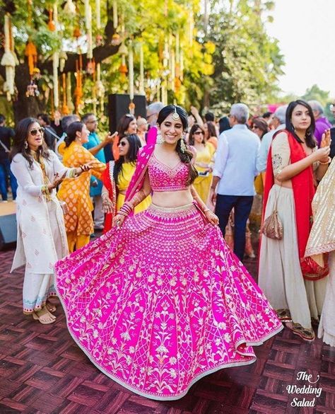 Gorgeous pink lehenga with golden colored motifs. See more on wedmegood.com #wedmegood #indianwedding #indianbride #lehenga #lehengacholi #bridallehenga #bridallehengacholi #pink #mehendi #henna #bridalmehendi #hotpinklehenga #bridalwear Pink Lehenga Bridal, New Lehenga Design, Mendhi Outfit, Pink Bridal Lehenga, New Lehenga, Trendy Bridesmaids, Lehenga Bridal, Lehenga Design, Bollywood Lehenga