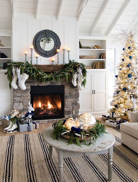 Capture the look of wintry-rustic elegance in your home by decorating your Christmas trees with a winter wonderland theme. Lake House Christmas, House Christmas Decor, Christmas Rooms, Fireplace Renovation, Lilypad Cottage, Christmas Fireplace Decor, Christmas Board, Christmas Mantel Decorations, White Christmas Decor