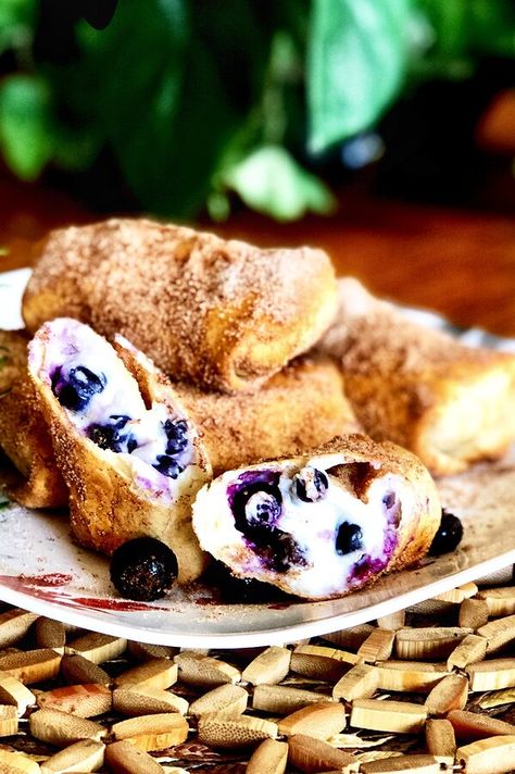 Air Fryer Blueberry Chimichangas | "Blueberries and flour tortillas filled with cream cheese and sour cream make these delicious air-fried chimichangas." #airfryer #airfryerrecipes #dinnerideas Air Fryer Blueberry, Tortilla Dessert, Daily Yum, Air Fryer Dessert, Desserts Cheesecake, Air Fryer Recipes Dessert, Air Fryer Desserts, Blueberry Cream Cheese, Recipes Air Fryer