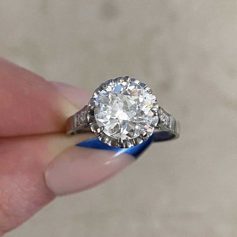 This elegant antique ring features an old European cut diamond center that is set in prongs and GIA-certified as 2.32 carats, J color, and SI2 clarity. Flanking each shoulder are three additional old European cut diamonds. This ring is further enhanced with a heart-style openwork design in the under-gallery, with two rows of additional old European cut diamonds set underneath and fine milgrain. The total approximate weight of the additional diamonds is 0.28 carats. From the Art Deco era, circa 1 Vintage Diamond Earrings, European Cut Diamond Ring, Estate Diamond Jewelry, Designer Diamond Jewellery, Colored Diamond Rings, Flash Mob, Cushion Cut Ring, Fancy Diamonds, Antique Necklace