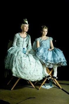 Mia Wasikowska as Alice Kingsleigh and Lindsay Duncan as Helen Kingsleigh from "Alice in Wonderland" (2010) by Tim Burton. The Victorian gowns were designed by Colleen Atwood; Alice's iconic blue gown is reimagined as something looser and less formal than most gowns of the period, reflecting the character's individual streak. Appropriately, Alice's gown features hand embroidered animal silhouettes on the hem including (what else?) a white rabbit. Alice In Wonderland 2010 Costumes, Mia Wasikowska Alice In Wonderland, Wonderland Moodboard, Alice Kingsleigh, Alice In Wonderland 2010, Lindsay Duncan, Colleen Atwood, Alice In Wonderland Dress, Alice In Wonderland Aesthetic