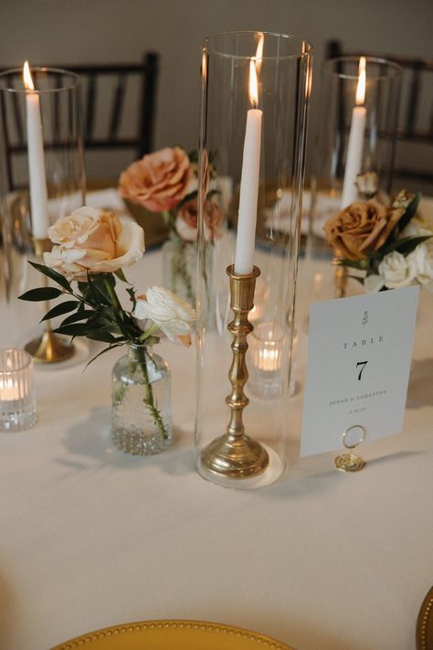 Minimalist Wedding Circle Table Decor, Candle Only Table Decor Wedding, Minimal Flower Centerpieces Wedding, Taper Candles And Bud Vases Wedding, Wedding Candlestick Centerpieces, Candlestick Centerpiece Wedding Round Table, Clean Wedding Table Decor, Candle And Flower Centerpieces Round Table, Wedding Table Decorations Gold Candlesticks