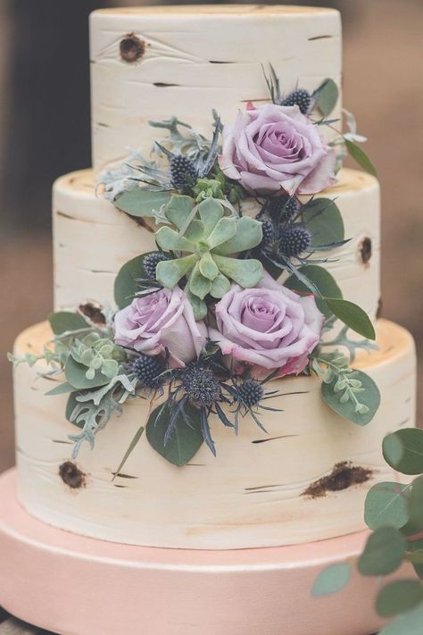 An enchanting wedding cake for an outdoor woodland ceremony.  The three-tier cake is covered in fondant that's been decorated to look like birch bark and flowers: lilac roses, succulents, and eucalyptus. Follow the link to see more of these woodland inspired wedding details (Photo: Melodic View Photography) #woodlandwedding #outdoorweddingideas Bark Wedding Cake, Wedding Cakes Lilac, Succulent Wedding Cakes, Lavender Wedding Cake, Purple Wedding Cake, Woodland Wedding Inspiration, Succulent Cake, Wedding Cake Fresh Flowers, Green Wedding Cake