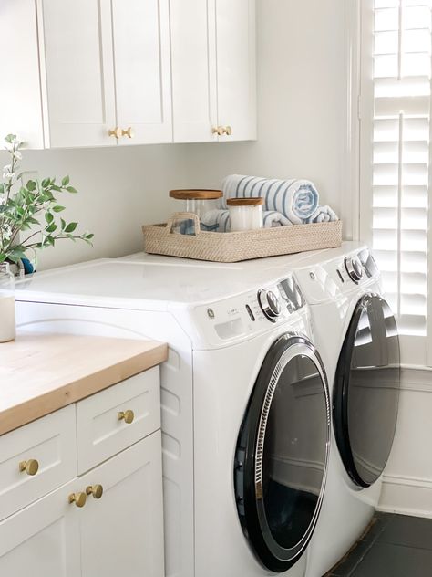 An honest review of our washer and dryer and how our family loves the GE Ultrafresh machines. We were able to get rid of the bad smell and mold in washing machines with the GE Microban technology. Coastal laundry room inspiration. Laundry In Master, New Build Must Haves, Laundry Room Ideas Modern, Coastal Laundry Room, Coastal Laundry, Ge Washer And Dryer, Laundry Room Essentials, Minimalist Laundry, Laundry Remodel