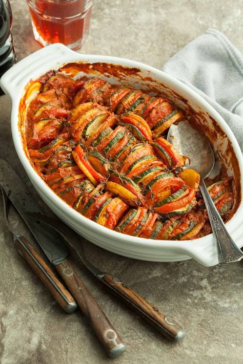 Seasonal vegetables are sliced and stacked onto a simple tomato sauce base to make this rustic and flavorful vegetable tian. Challenging Recipes, Vegetable Tian, Simple Tomato Sauce, Easy Tomato Sauce, Seasonal Vegetables, Classic French Dishes, Flavorful Vegetables, Baked Vegetables, French Dishes