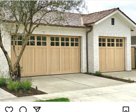 Garage Doors White Brick House, Matching Front Door And Garage Door, Curved Garage Doors, Plank Garage Door, Modern Farmhouse Garage Door, Natural Wood Color Garage Door, Garage Doors Wood, Cottage Garage Doors, Light Wood Garage Door