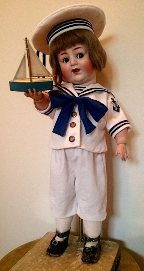 Alt Beck & Gottschalk 24 inch tall bisque boy doll with flirty eyes and a wobble tung. His original mohair wig is in excellent condition . He has a toddler body of papier-mâché composition arms & legs with wood ball joints   Circa 1900-1910  He's dressed in a velveteen sailors suit holding a toy boat Flirty Eyes, Sailor Doll, Reborn Toddler Dolls, Toy Boat, Barbie Gowns, Male Doll, Sailor Dress, German Dolls, Unique Dolls