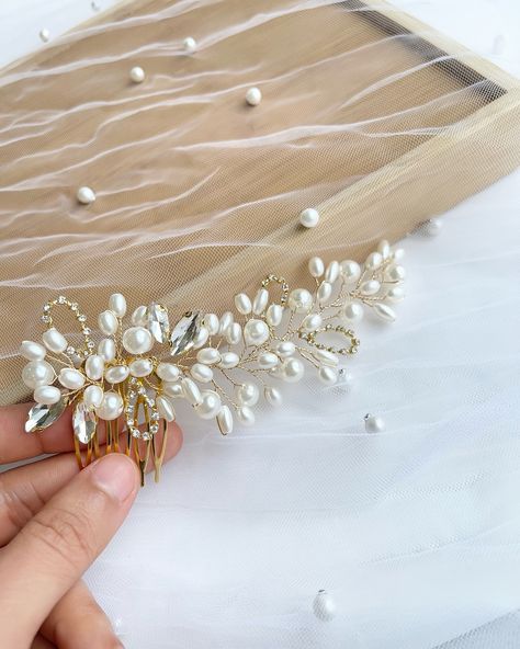 A stunning gold bridal comb adorned with pearls, crystals, and rhinestones, a regal touch for your special day.”✨❤️ #bridalaccessories #bridalcomb #bridalheadpiece #yeghandmade #bridetobe Bridal Comb, Gold Background, Pearl Crystal, Pearl Wedding, Sparkling Crystal, Bridal Headpieces, Your Special, Bridal Accessories, Pearl White