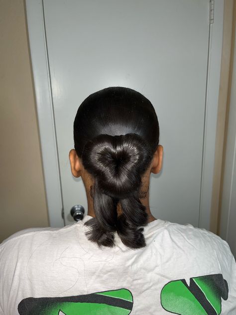 Sleek bun shaped like a heart Sleek Heart Bun, Heart Bun With Curls, Heart Shaped Slick Back Bun, Heart Shaped Hairstyles For Black Women, Heart Swoop Bun, Heart Bun Half Up Half Down, Heart Shaped Bun Hairstyles, Low Bun For Prom, Heart Bun Black Women